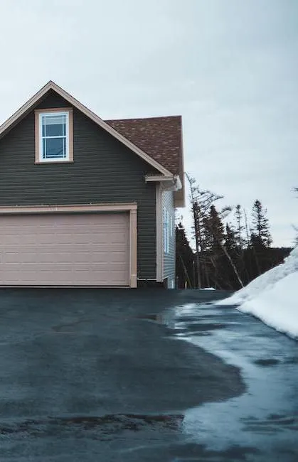 Asphalt driveway during winter, showcasing the importance of asphalt driveway repair and protection.